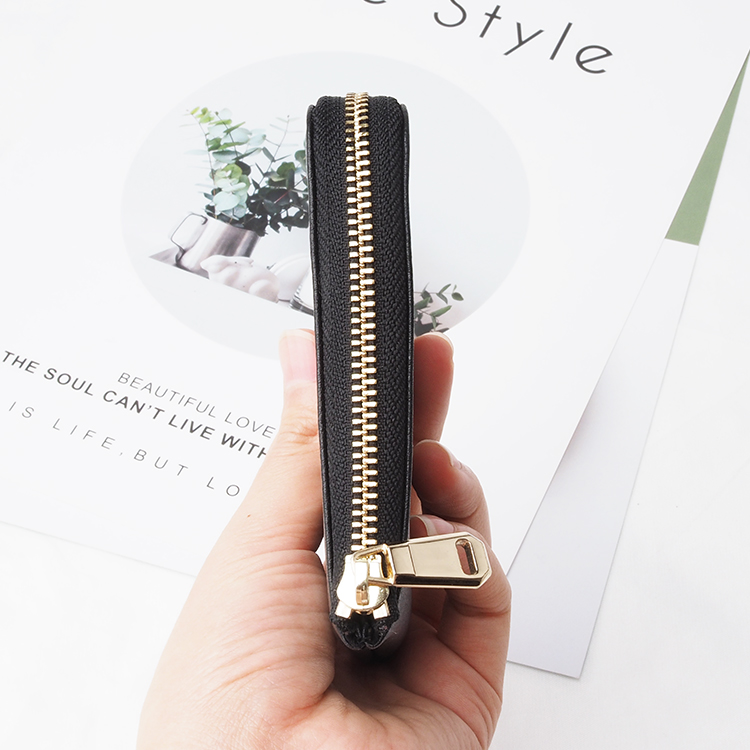 黑(hēi)色最小(xiǎo)卵石皮革拉鏈零錢(qián)包